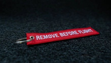 Red Embroidered Remove Before Flight Keyring