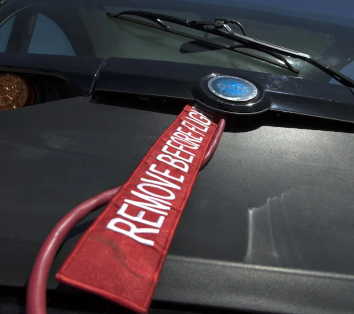 Aviation Safety: Red Security Ribbons Remove Before Flight Protecting the Cockpit Window